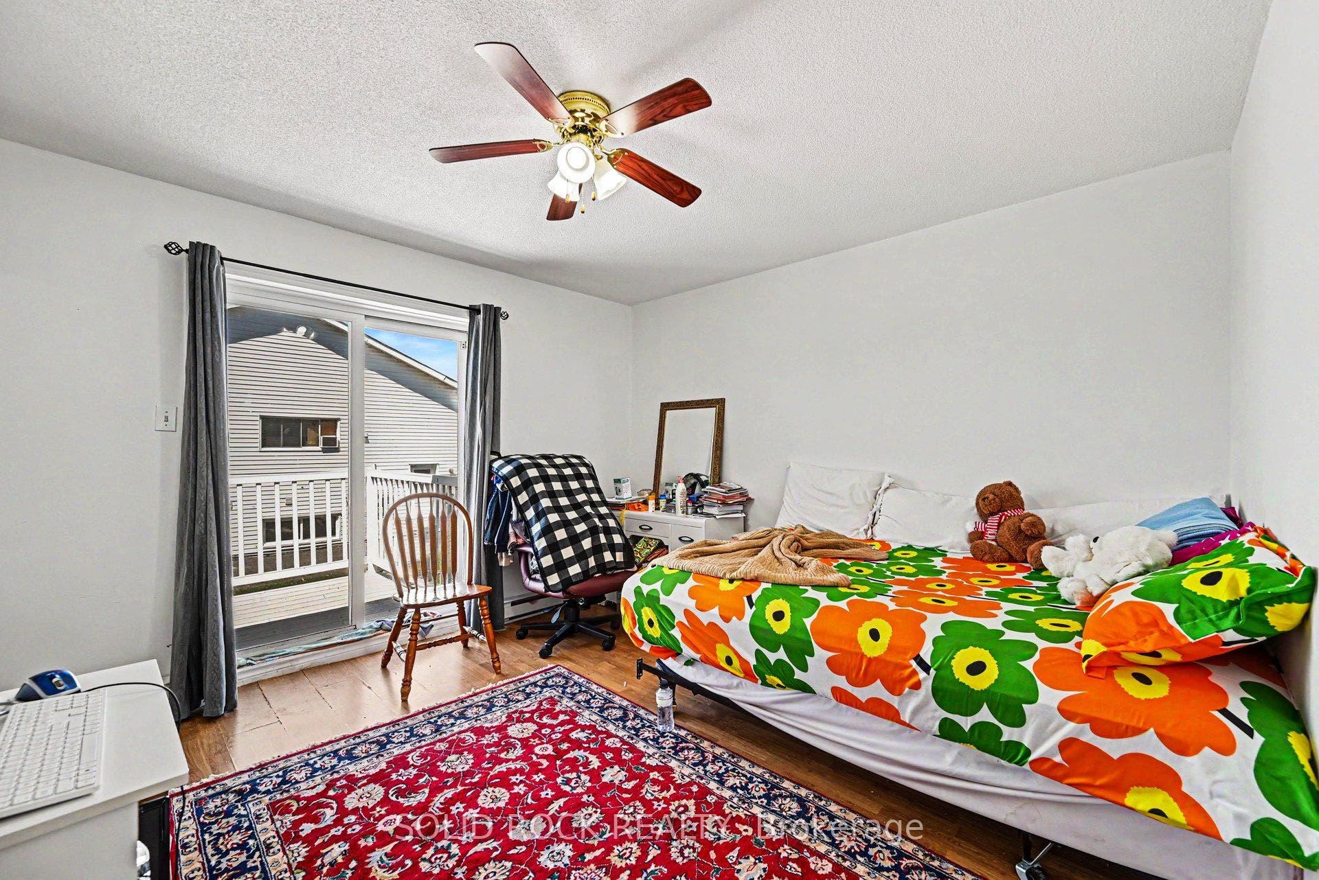 Unit 1 Bedroom with Patio Door