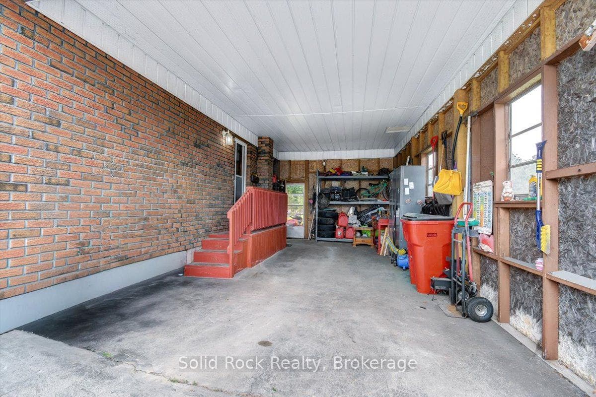 6168 County Rd 50 N/A, Trent Hills, Northumberland ON K0L 1L0 Carport/garage entrance into kitchen and backyard.