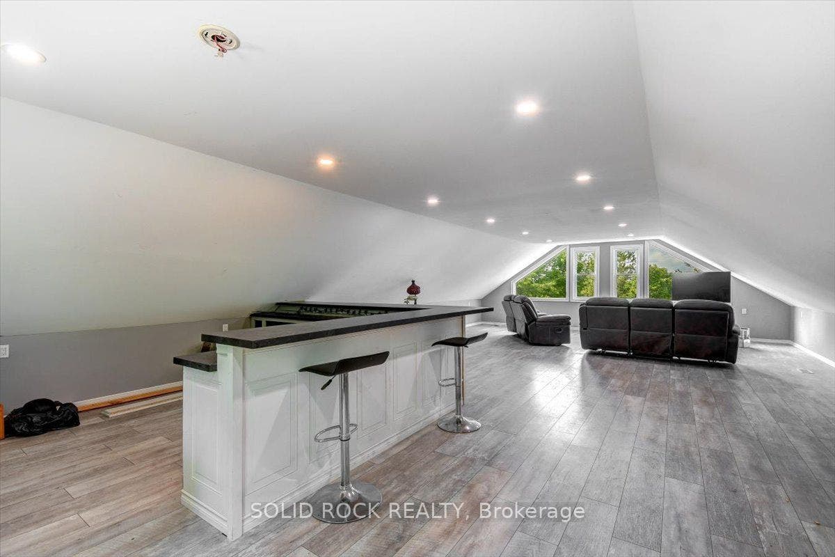 Loft With Picture Window & Exit to  Balcony