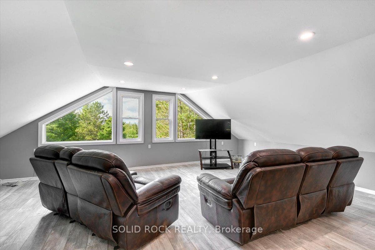 Loft With Picture Window & Exit to  Balcony