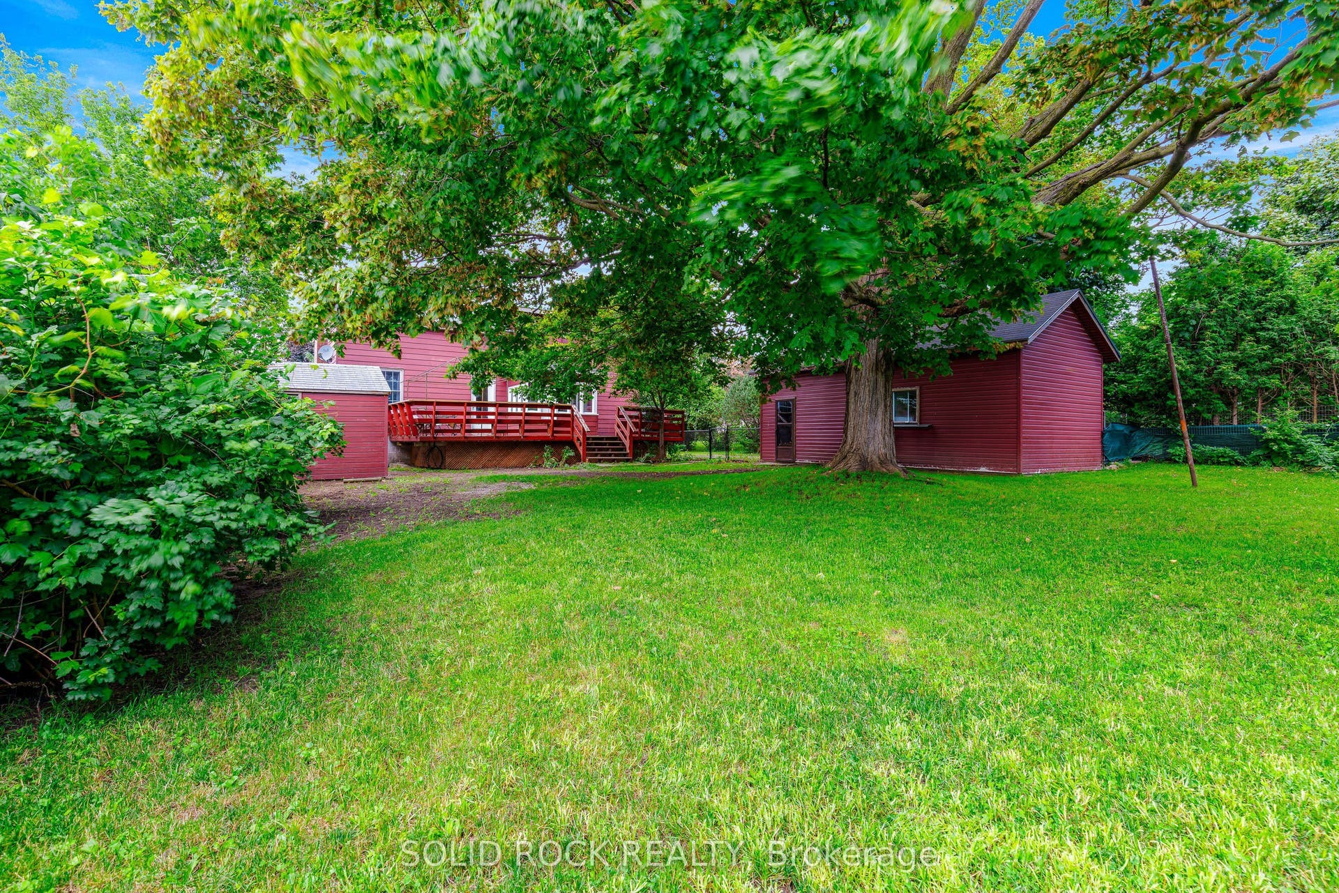 Detached garage is to right.