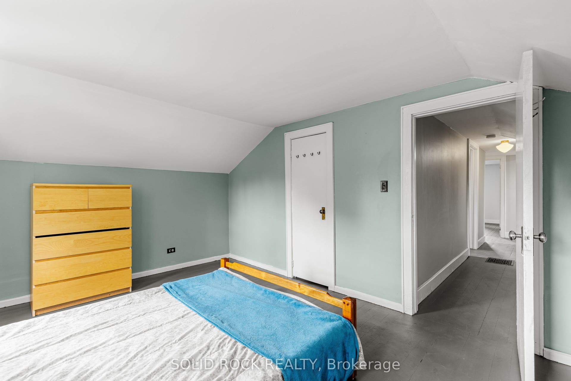Upper level has lovely painted pine flooring