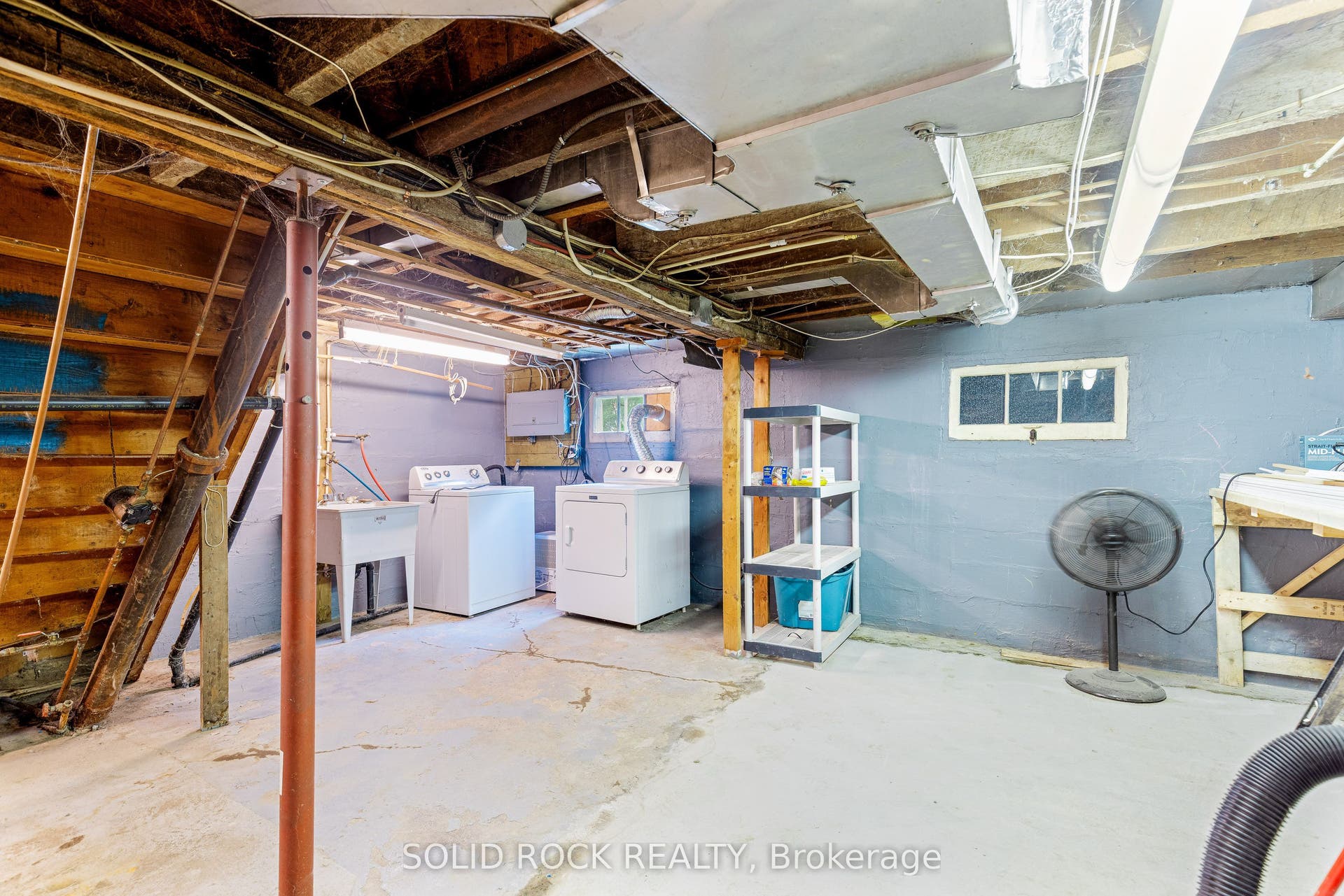 Basement laundry area-cement floor thru-out