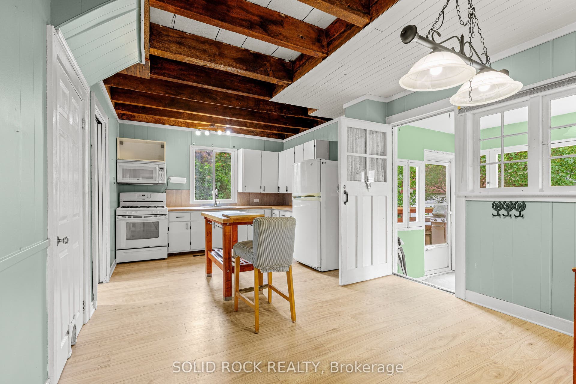 Rear door leads to 3-season porch/mudroom &to deck