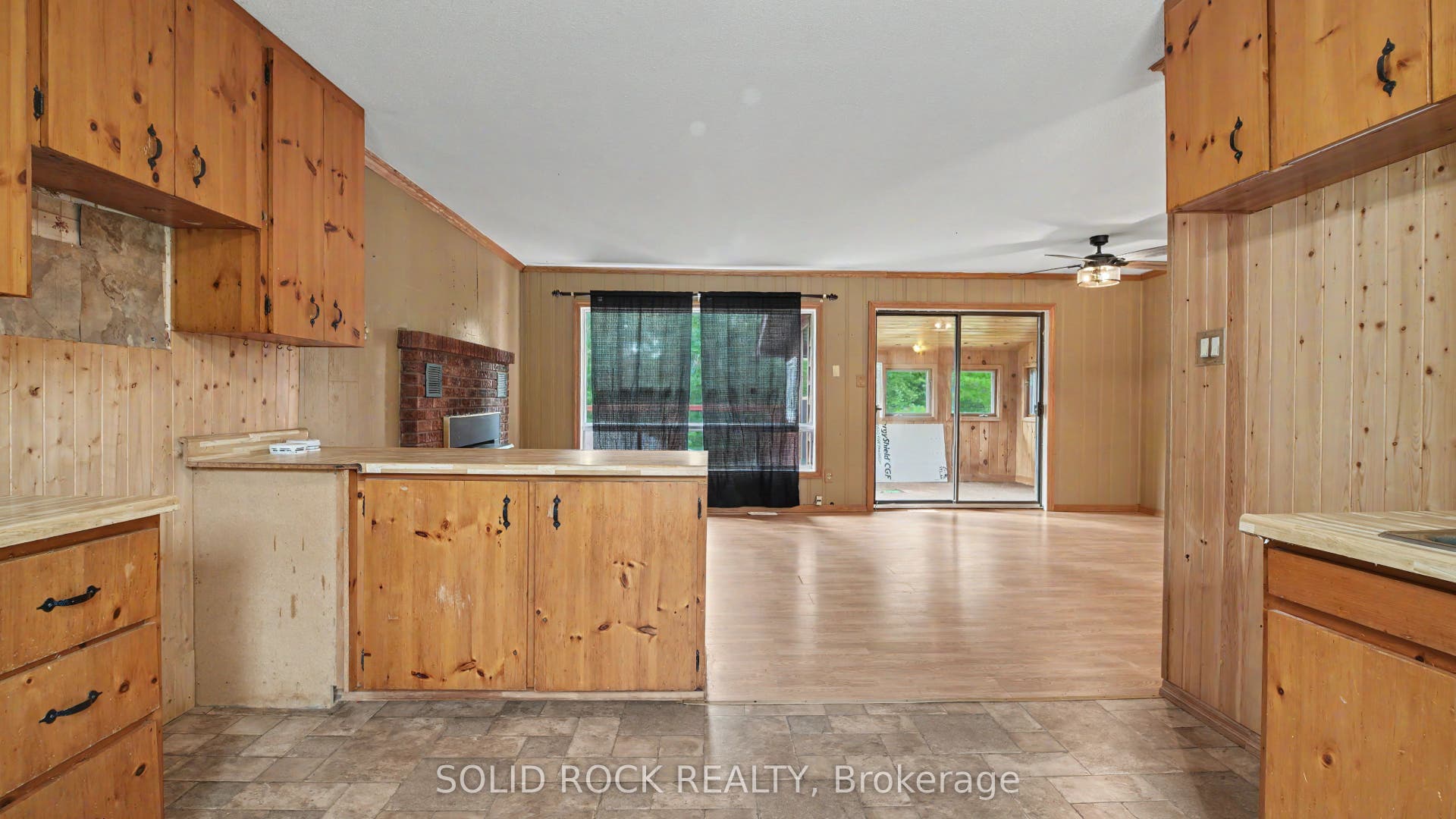 Kitchen through Living/Dining out to sunroom