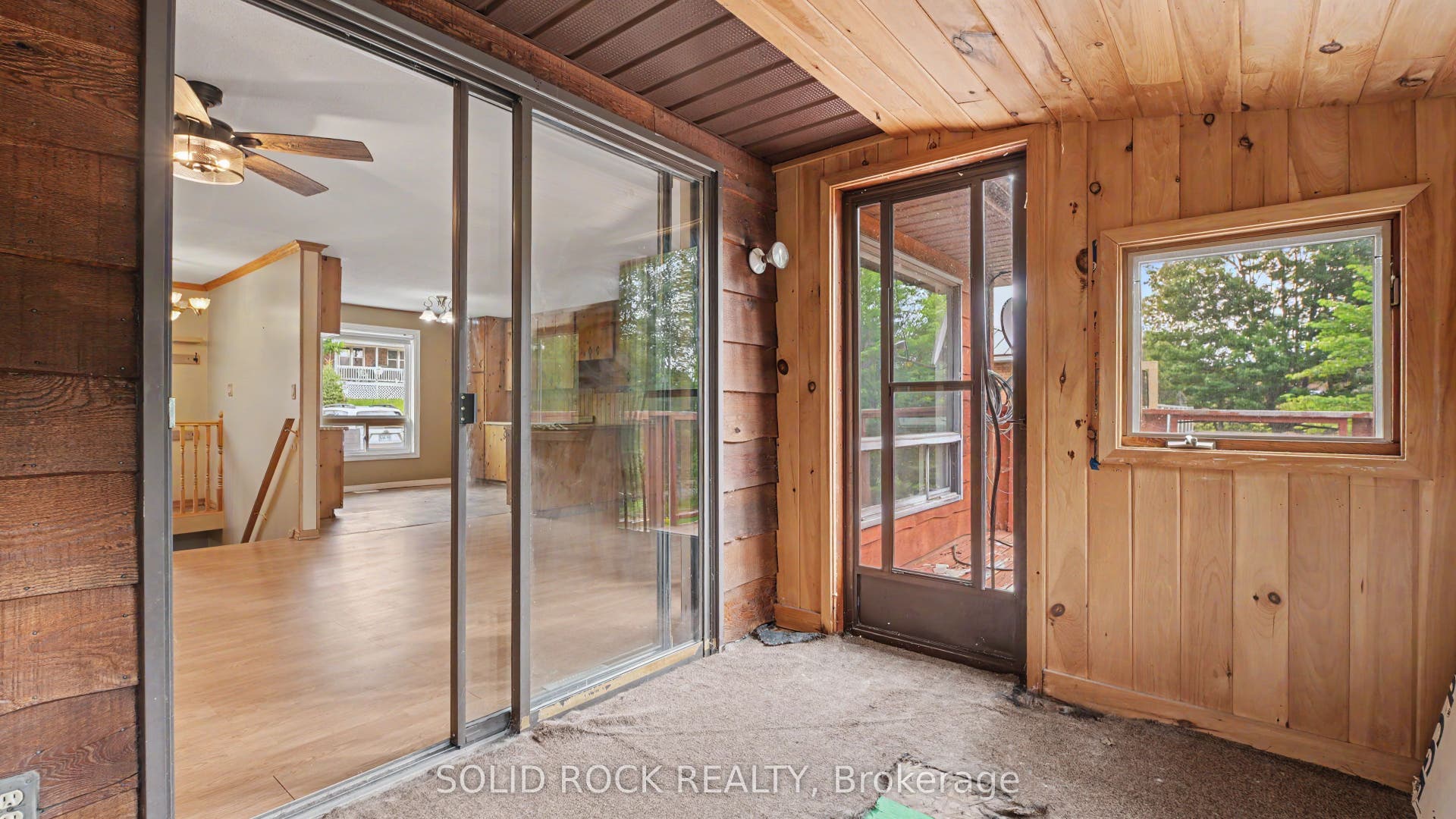 3 Season sunroom leads to deck