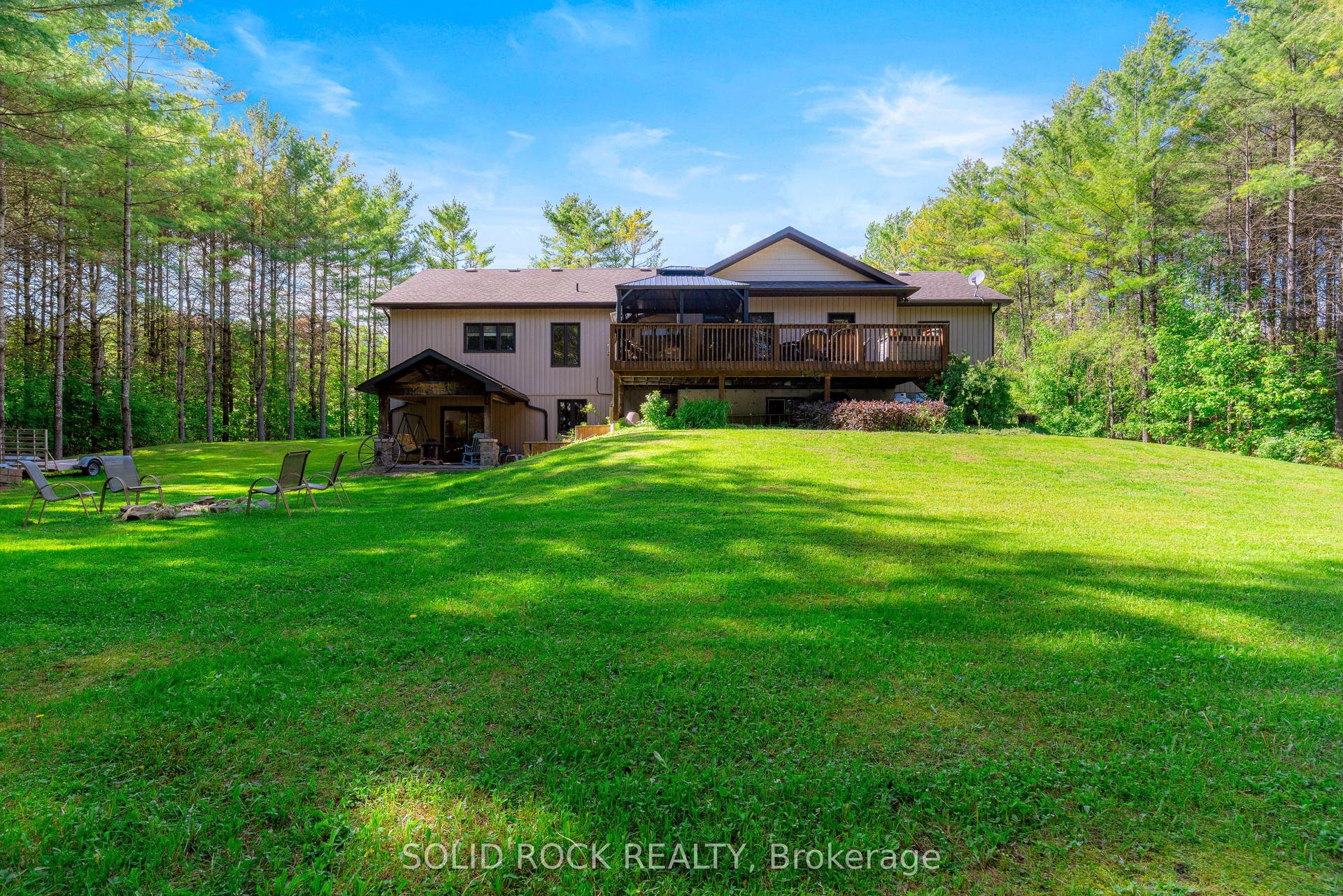 717 Upper Oak Leaf Road, Athens, Leeds And Grenville ON K0E 1B0 Mature pines surround the property.