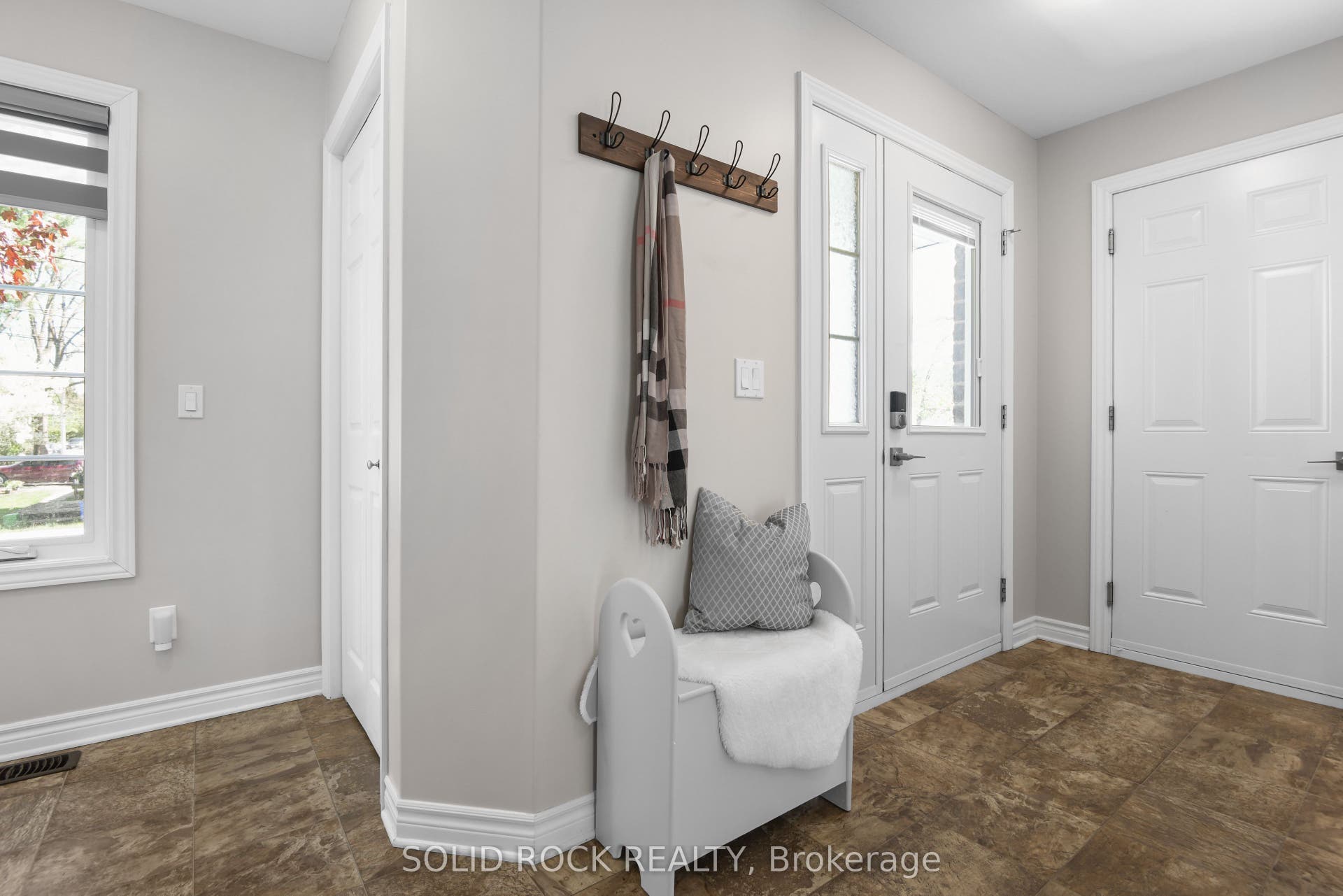 Entryway with storage closet. Garage inside entry.