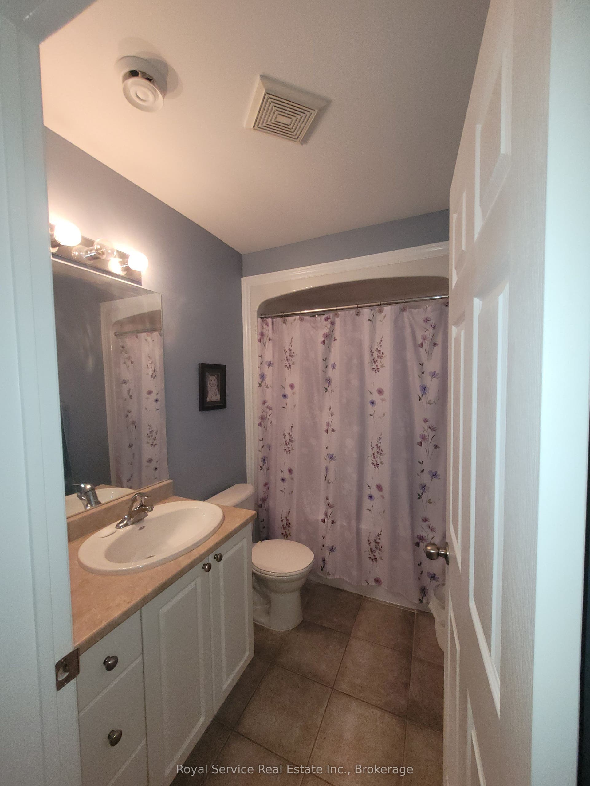 Full bathroom with over-bath shower