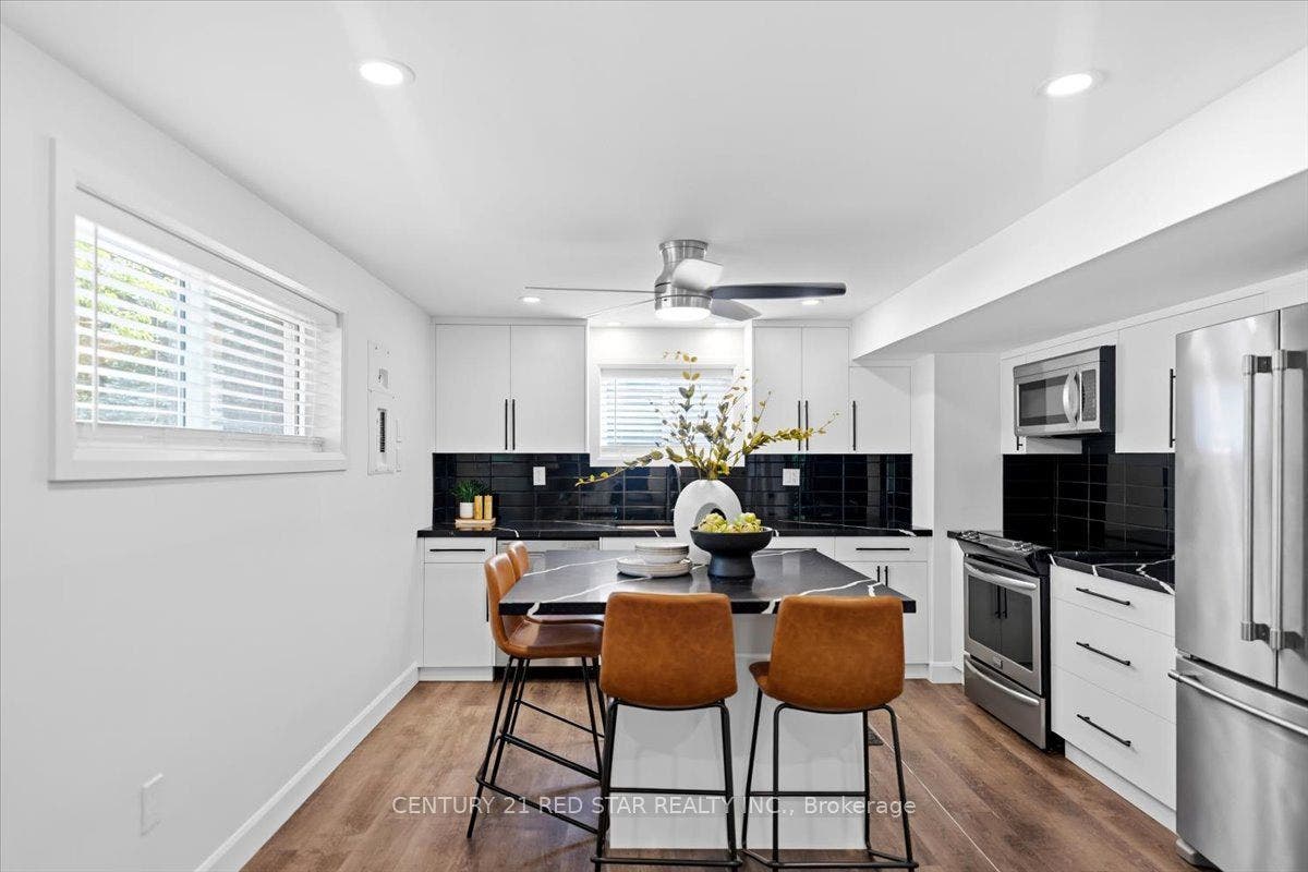 Full kitchen, stone counters, large windows