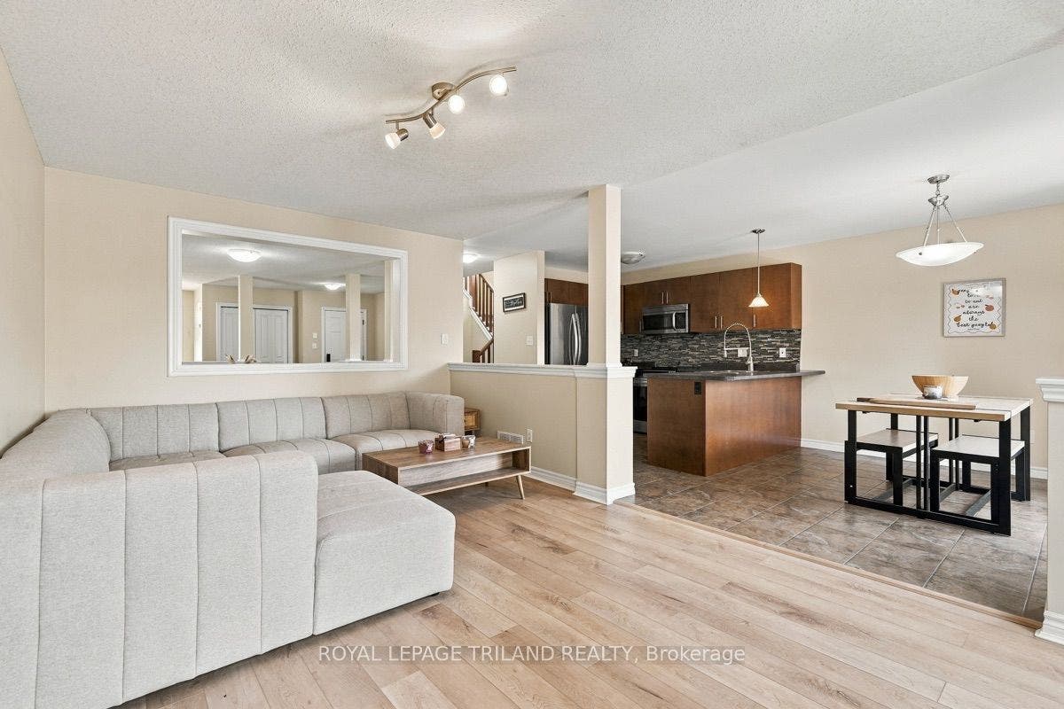 Main: Living Room Open to the Eat In Kitchen