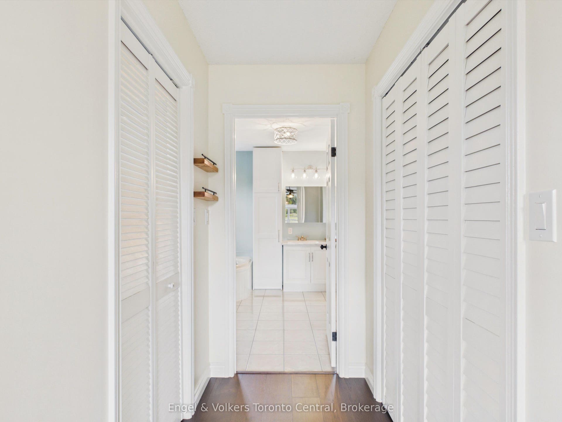 Two walk-in closets with access to upper bathroom