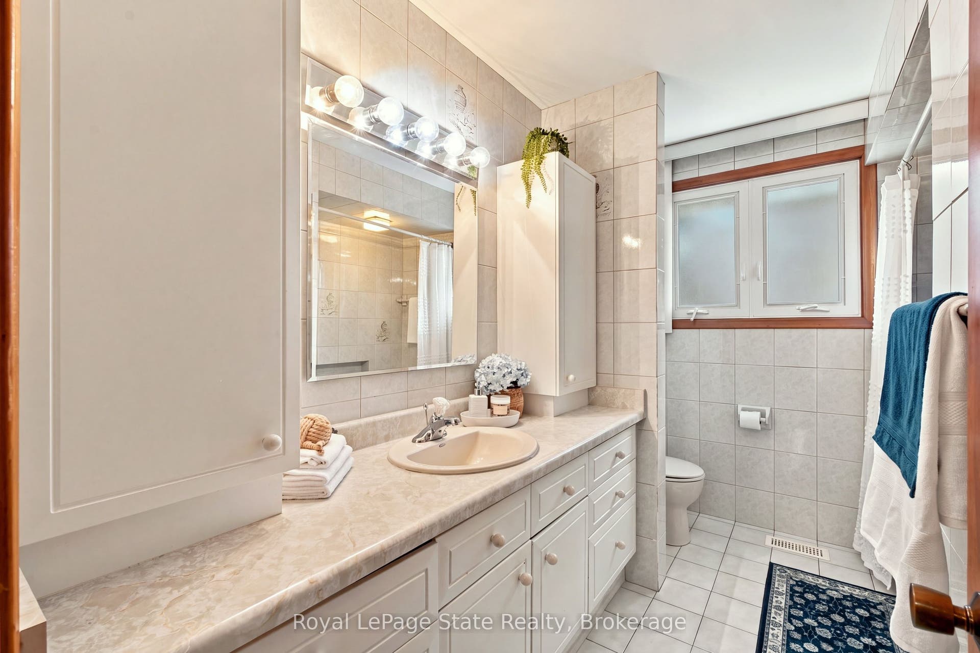 Main Bath w/massive vanity; perfect for families