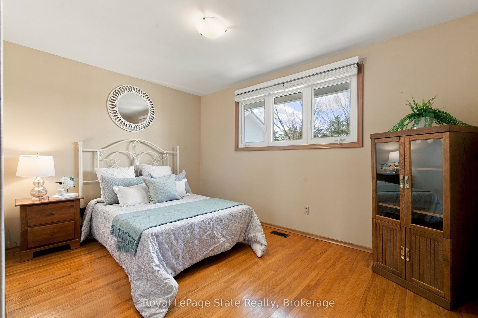 BEDROOM 2 with large closet and oversized window.