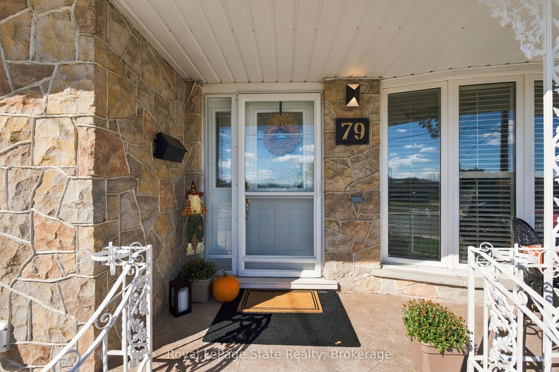 INVITING front porch; steel front & side doors!