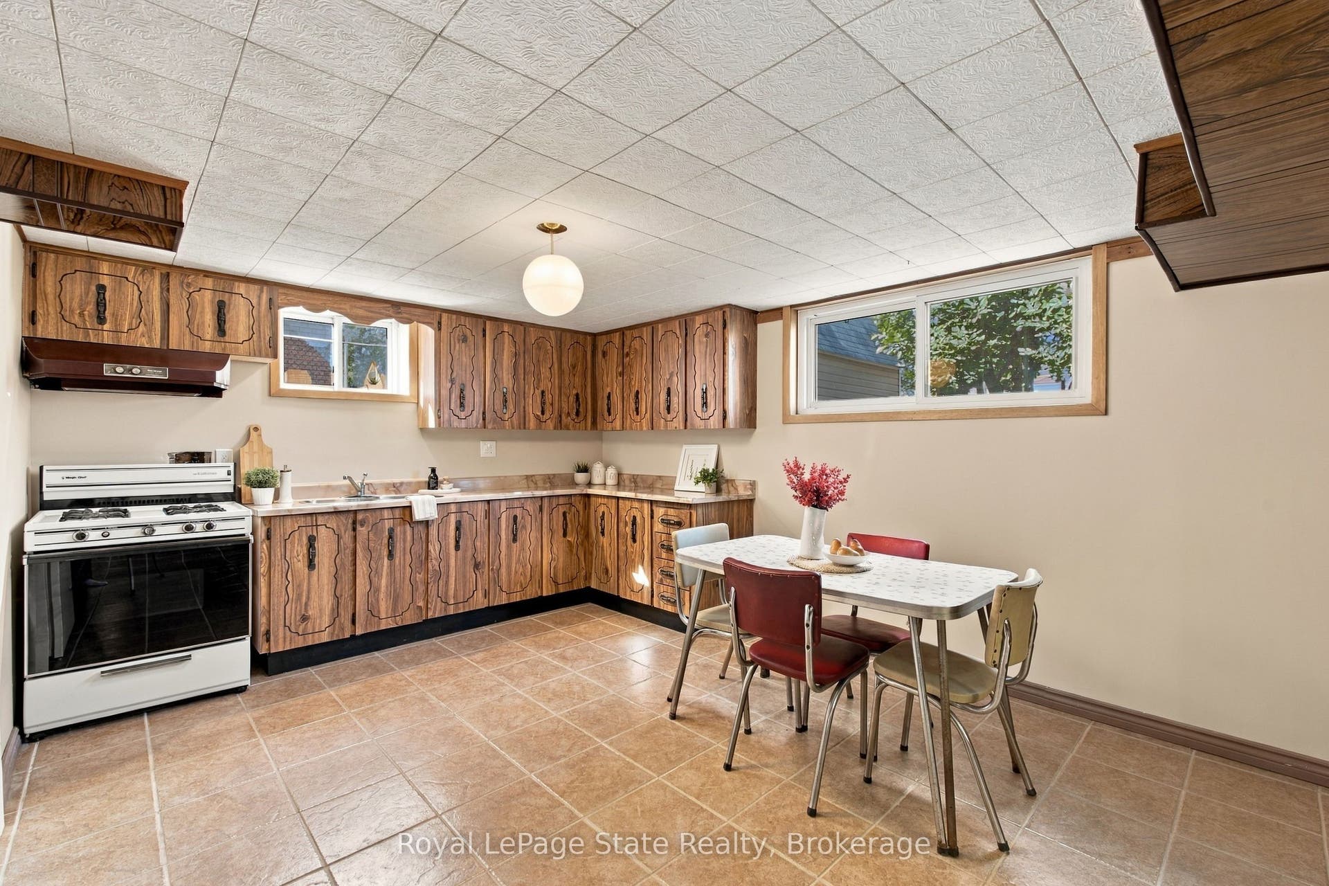 2ND KITCHEN in basement with gas stove & fridge.