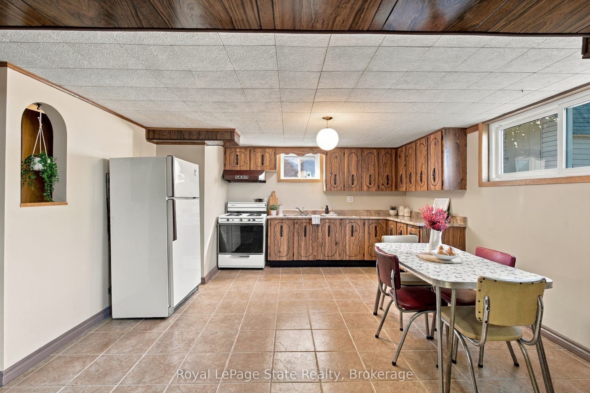 2ND KITCHEN in basement with gas stove & fridge.