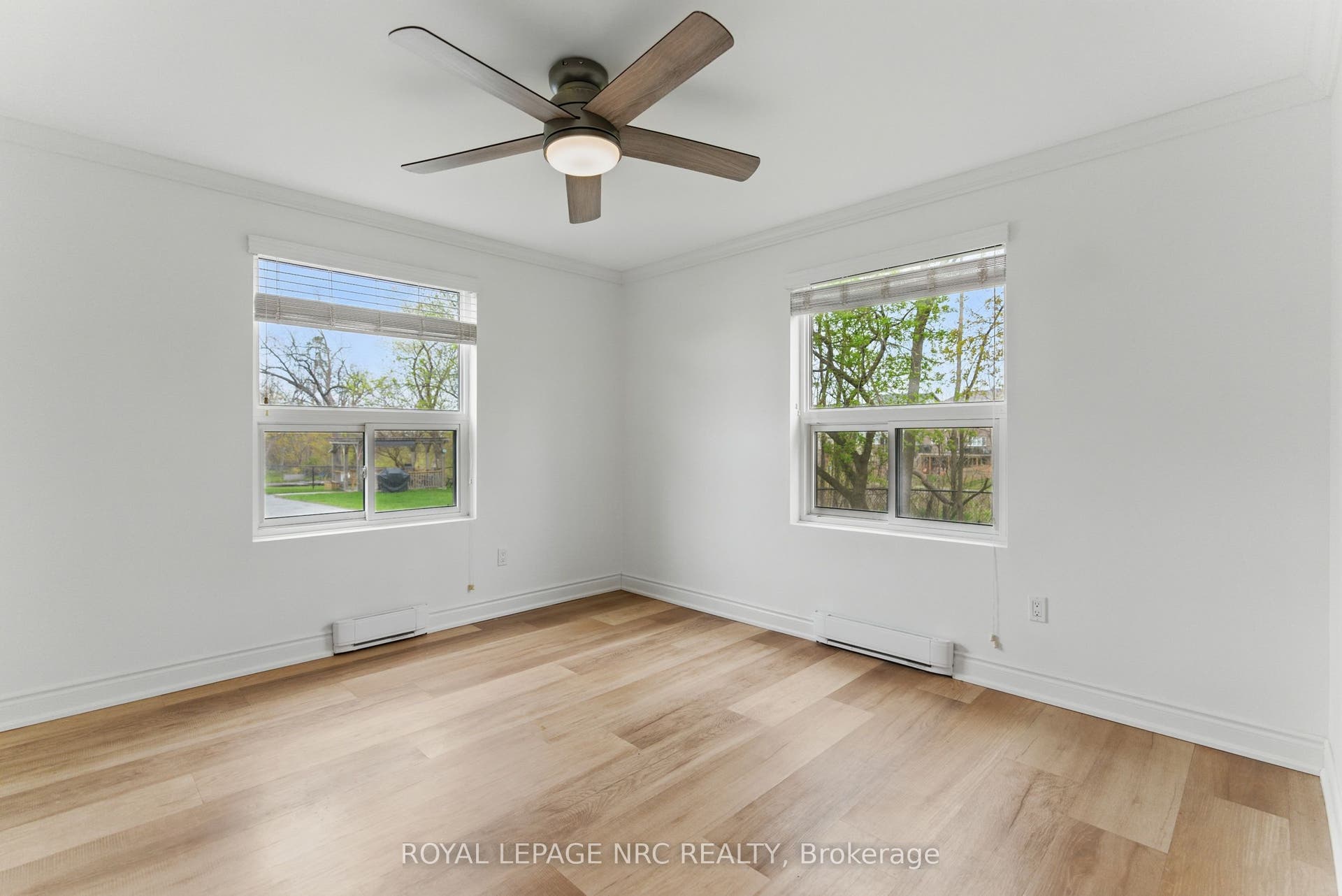 Primary bedroom with large windows & natural light