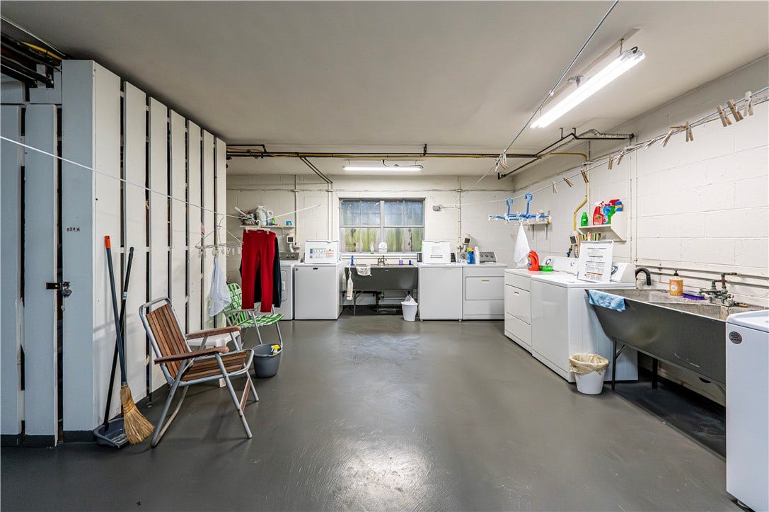 THERE IS A COMMUNAL LAUNDRY AREA. THIS UNIT COMES WITH ITS OWN WASHER & DRYER--THE TWO STRAIGHT AHEAD ON THE RIGHT UNDER THE BLUE HANGERS.