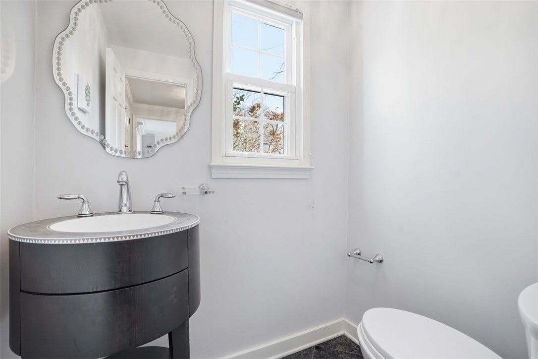 Main level half bath off the entry