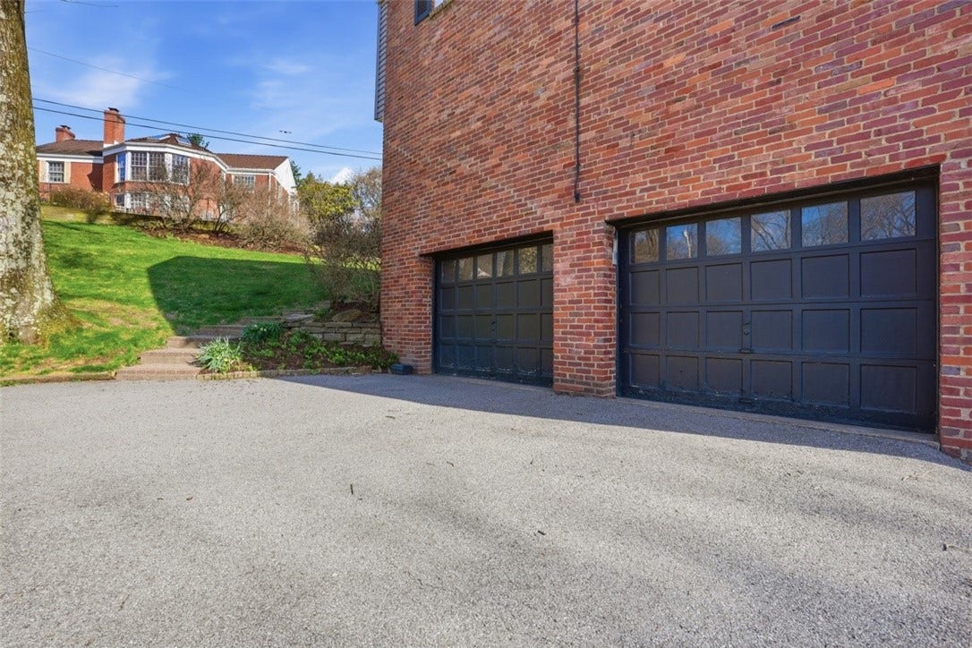 Driveway and two car garage.