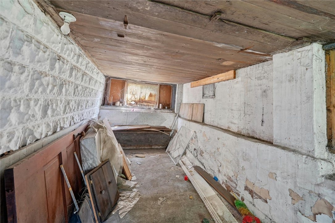 Extra storage area under the front porch.