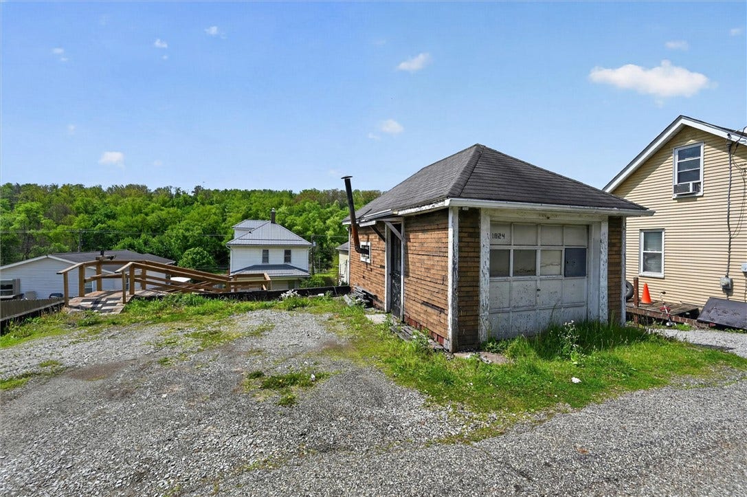 Small garage/workshop and off street parking.