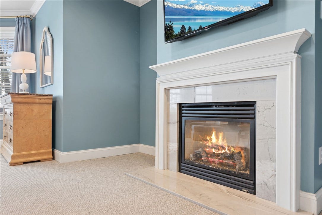 gas fireplace in the primary bedroom