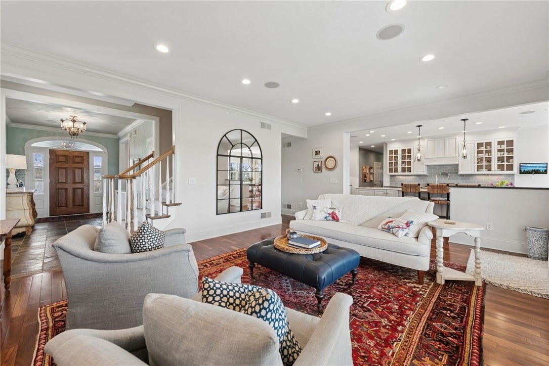 view from the living room towards the front entry and the kitchen