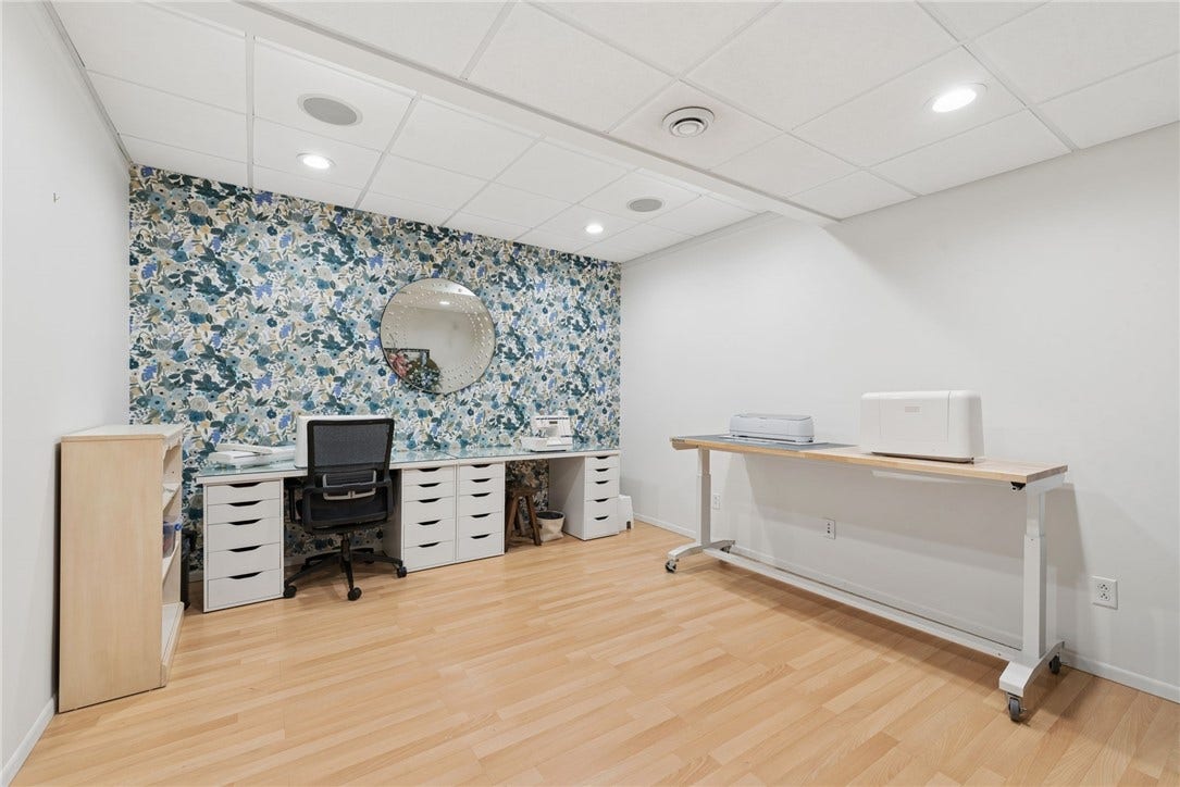 flex room in the lower level. set up for a craft room now but can be office, fitness, playroom or anything you can think of.