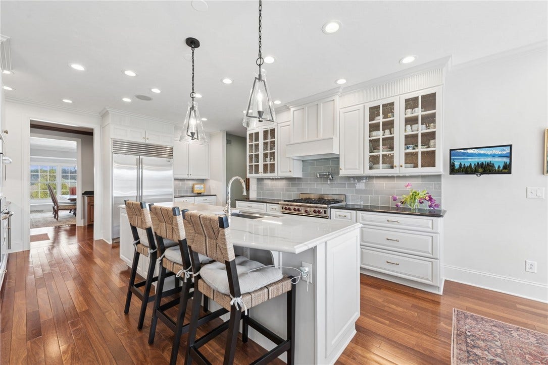 Counter seating, kitchen mixer lift, pot filler over range, wine cooler