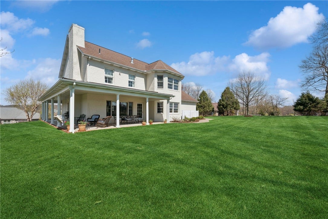 This has such a expansive level backyard. The covered patio is great for relaxing under & for entertaining