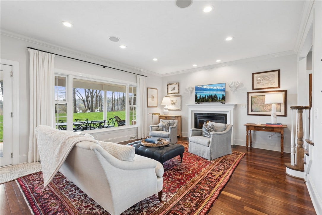 large window overlooks the level backyard. Gas fireplace. hardwood flooring & crown molding through out the main level