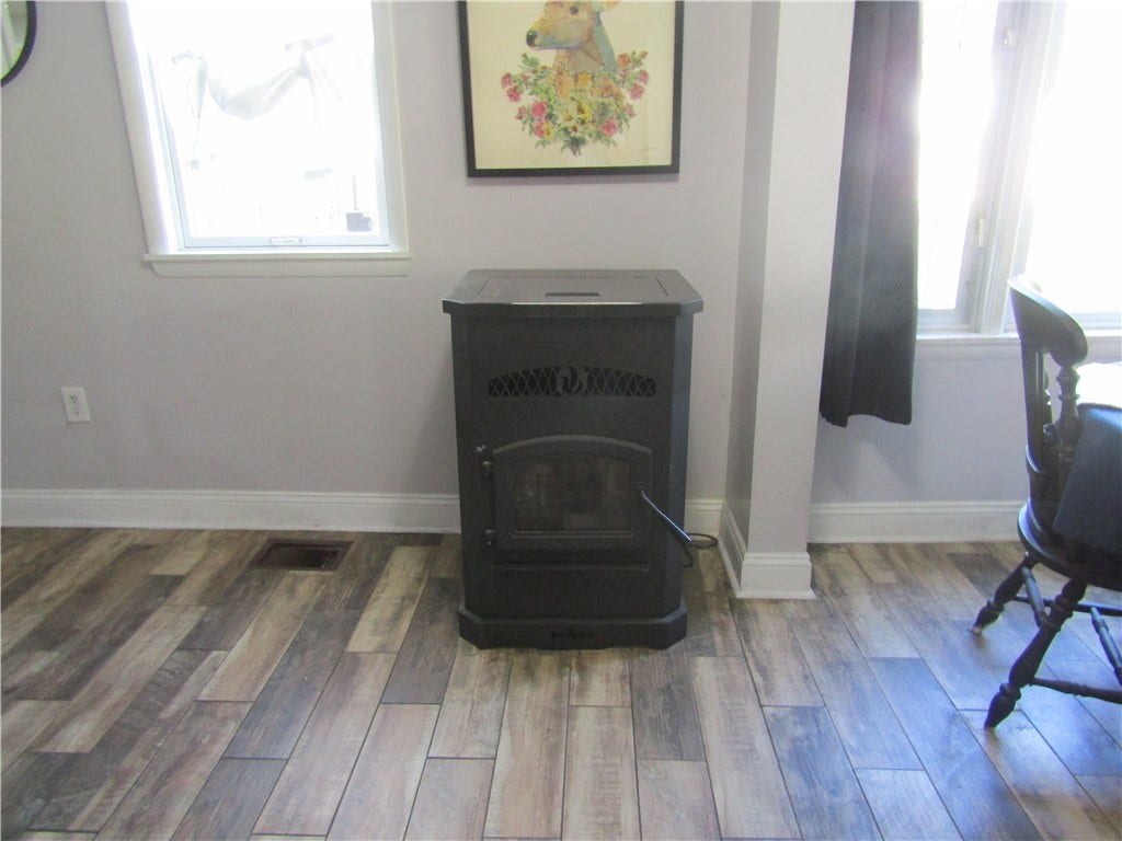 pellet stove between kitchen and dining area