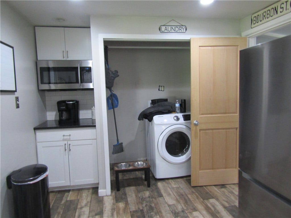 laundry and coffee bar with microwave