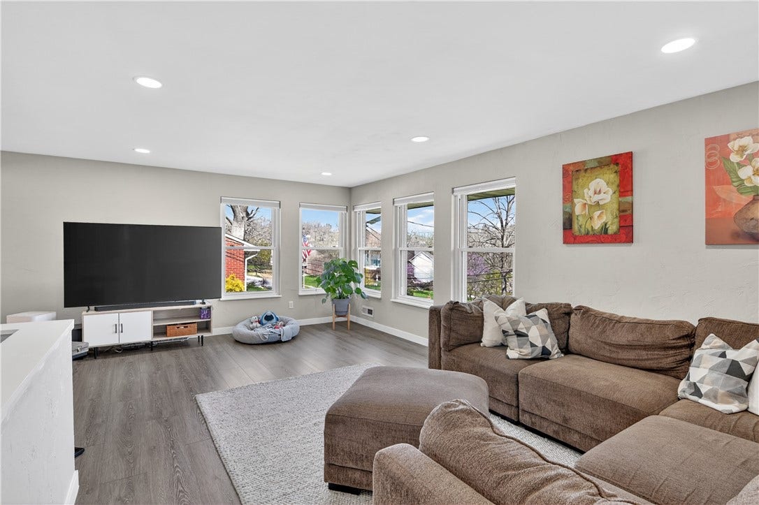 And another view of the living room capturing the two walls with windows that keeps this room light and bright!
