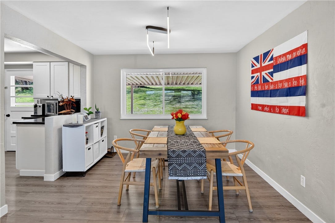 The dining room space with a view of the back yard