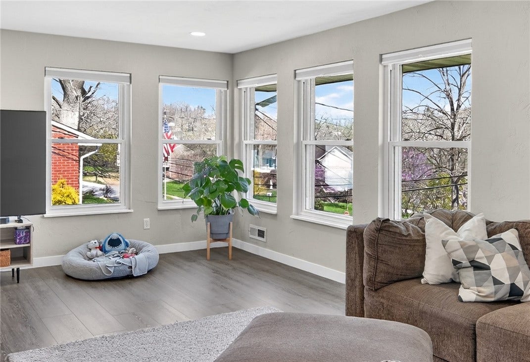 A cozy view of a small part of the living room that shares the family pet's special space.