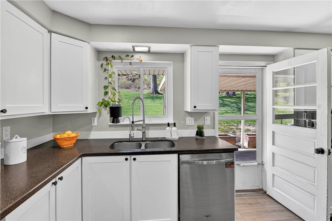 Light and Bright Kitchen view and into the back yard