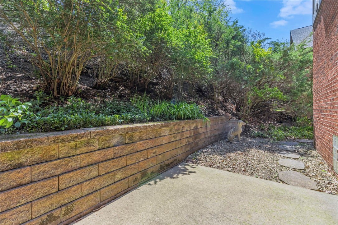 Quaint rear yard, with a small area for gardening, entertaining or just relaxing.