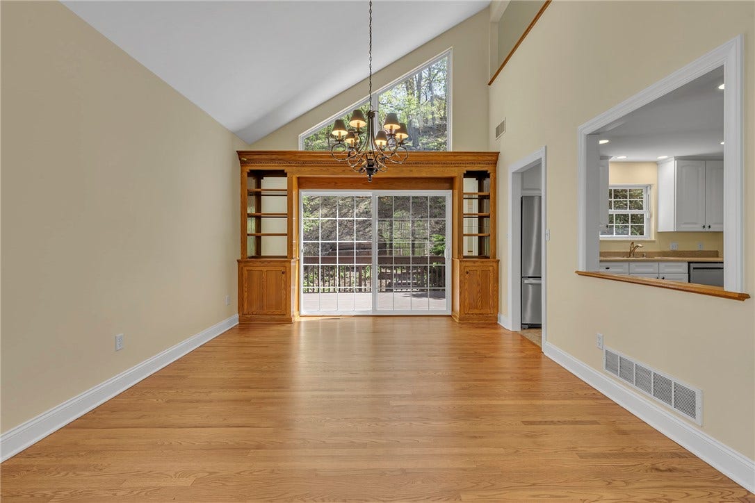 Custom built-in shelves and storage provide function in the dining area.