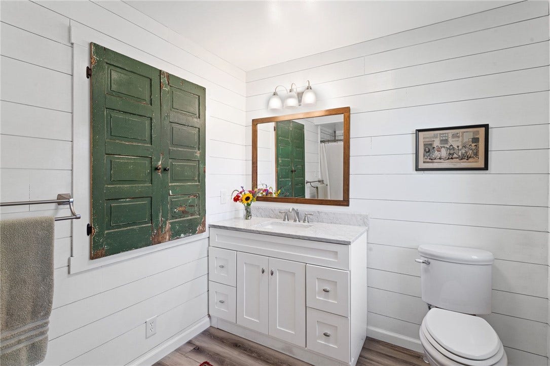 Updated bathroom spaces blend everyday function with classic farmhouse charm.