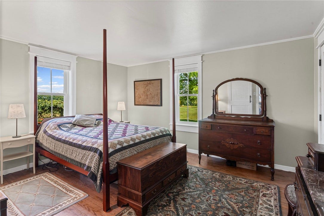 A convenient first floor primary suite offers comfort, privacy, and easy everyday living.