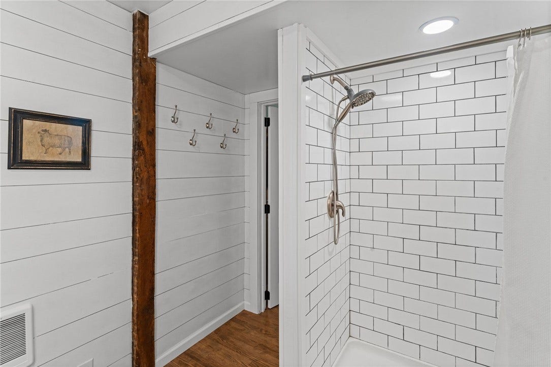 Updated bathrooms offer comfort and convenience while keeping the farmhouse feel.