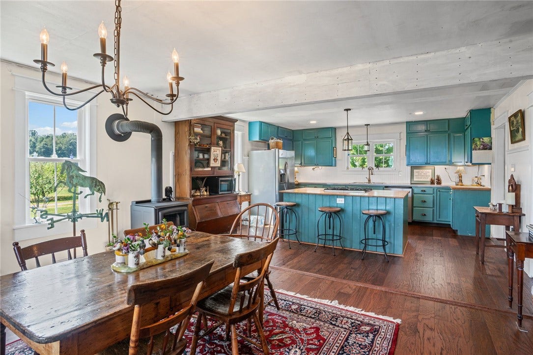 A bright dining area creates an inviting connection between the kitchen and living spaces