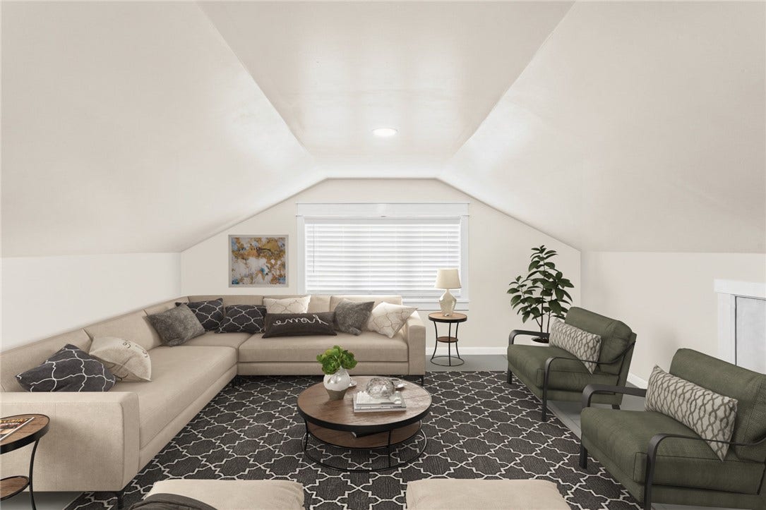 A comfortable second floor living space adds flexibility for guests, work, or relaxing.