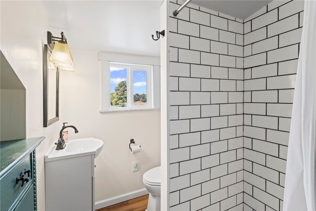 Thoughtfully designed bath spaces add everyday function for family, guests, and farm life.