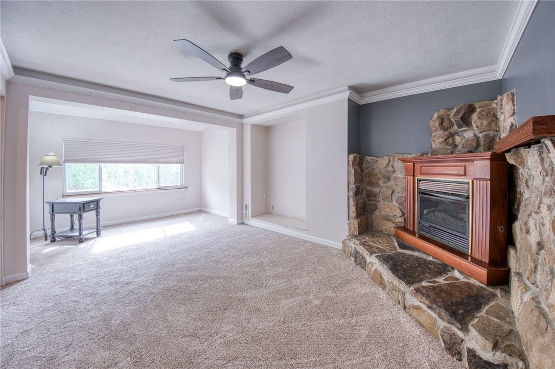 Family room with fireplace and built-in entertainment nook