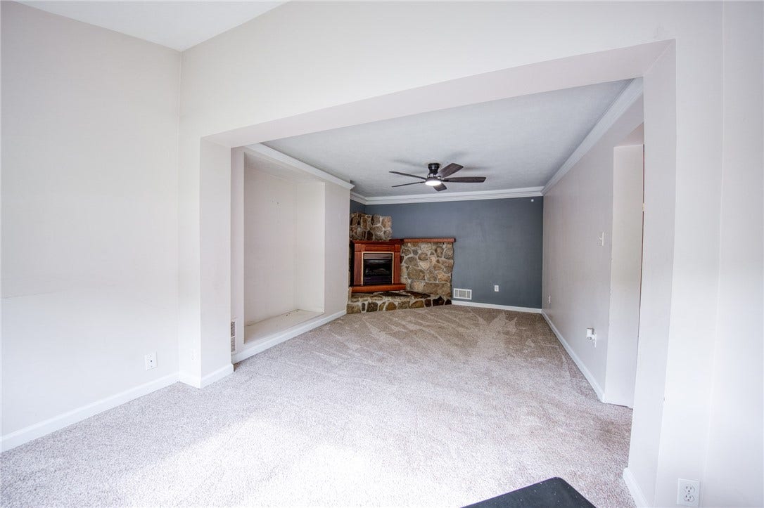 Family room with fireplace and built-in entertainment nook