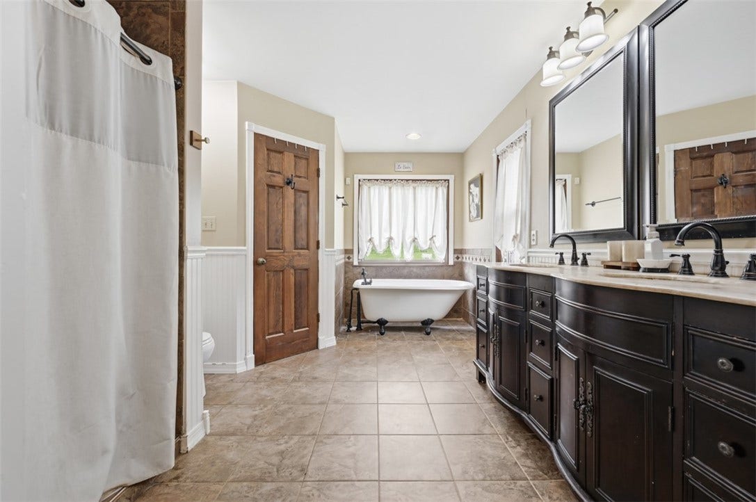 Spa-like owner's suite.  Walk-in closet and ceramic shower.  Doube-bowl sink